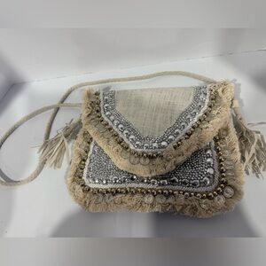 This is an off-white, handmade, Banjara-style, bohemian bag